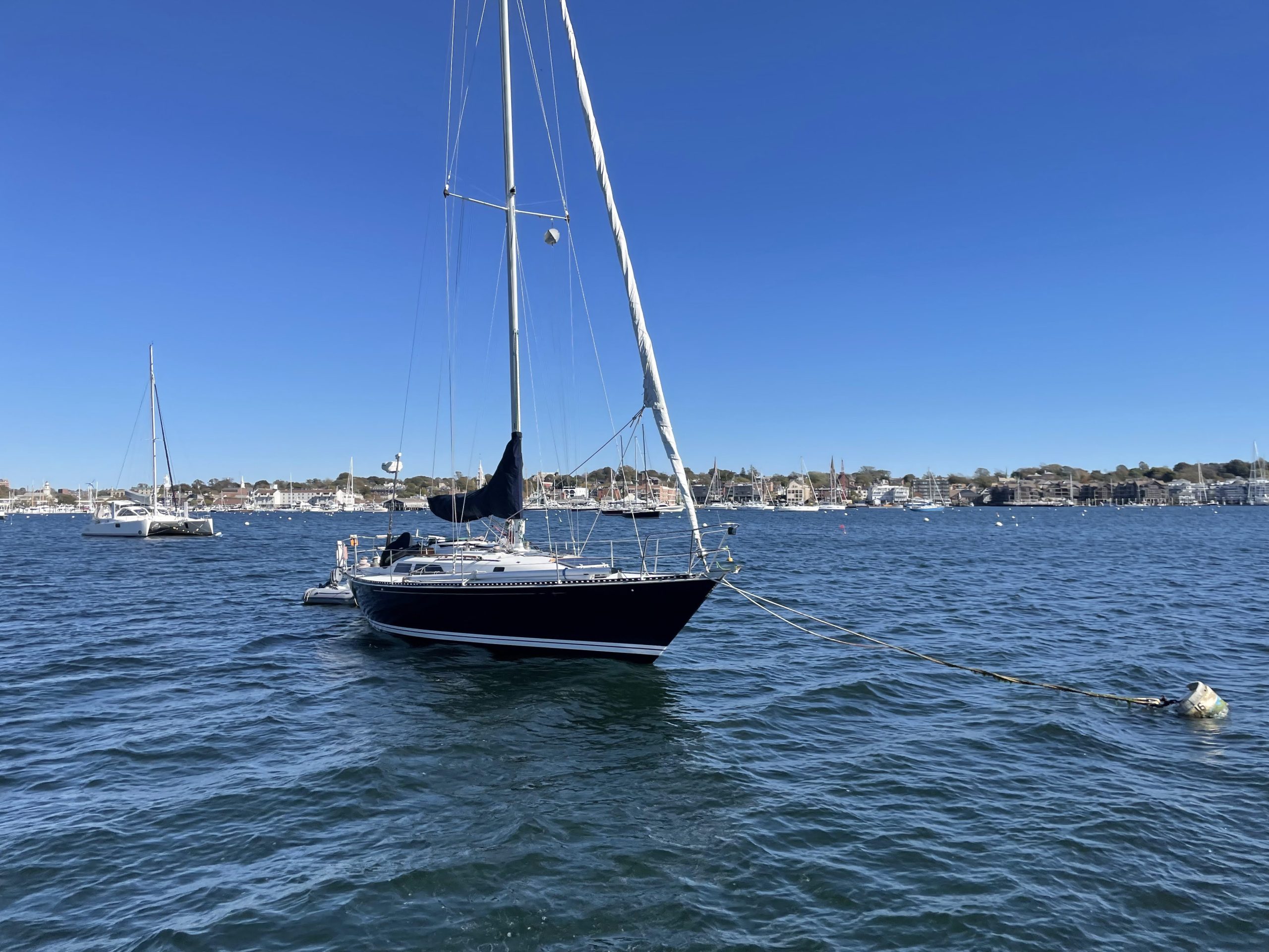 sailboat on the water with blue sky